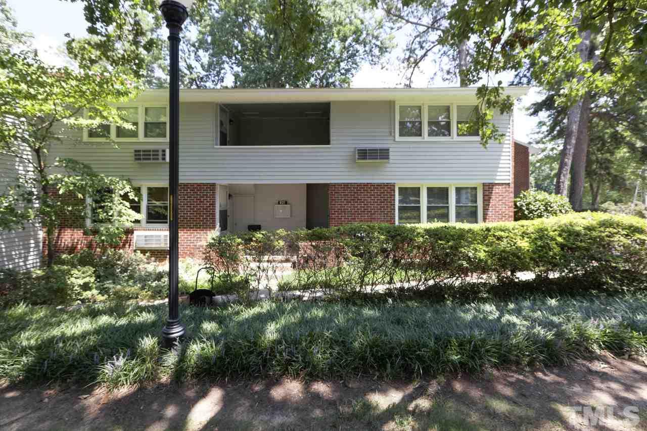 821 Daniels Street, Unit B Raleigh, NC 27605 - Photo 5 of 25 a view of a house with a yard and potted plants