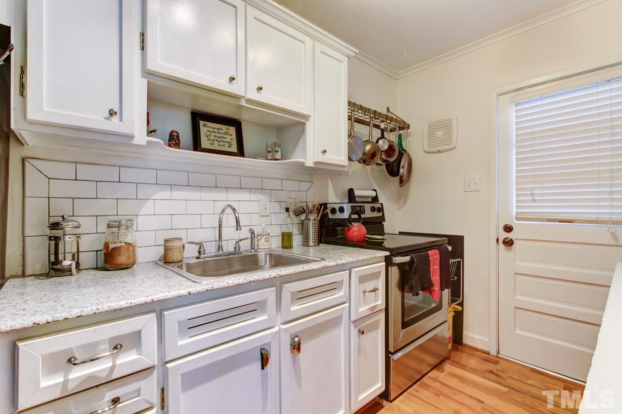 821 Daniels Street, Unit B Raleigh, NC 27605 - Photo 6 of 25 a kitchen with sink and cabinets