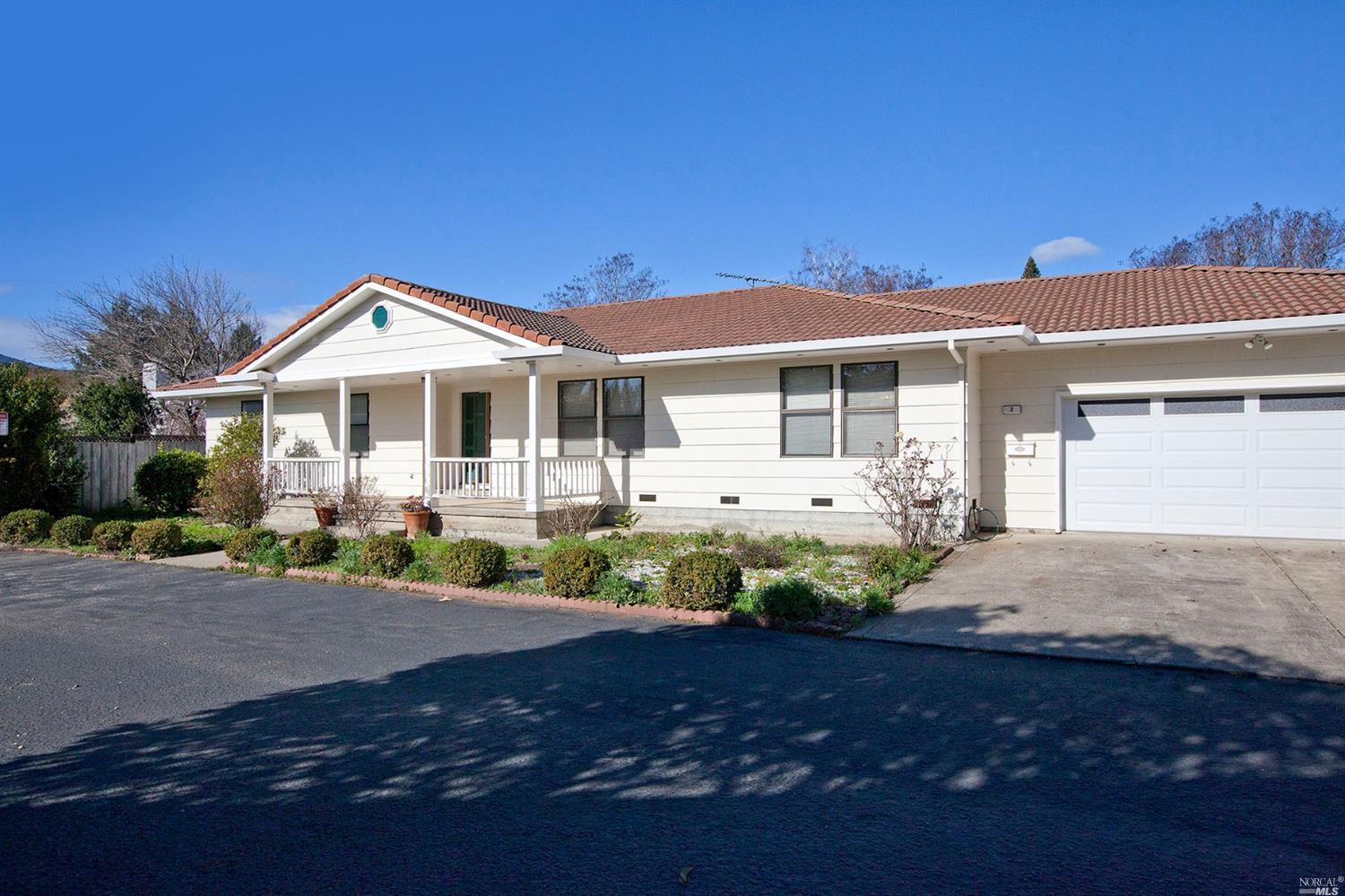 2 Borges Court Novato, CA 94947 - Photo 1 of 1 a front view of a house with a yard and potted plants