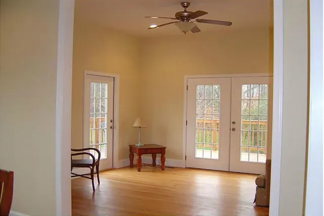 a view of a livingroom with furniture and hardwood floor