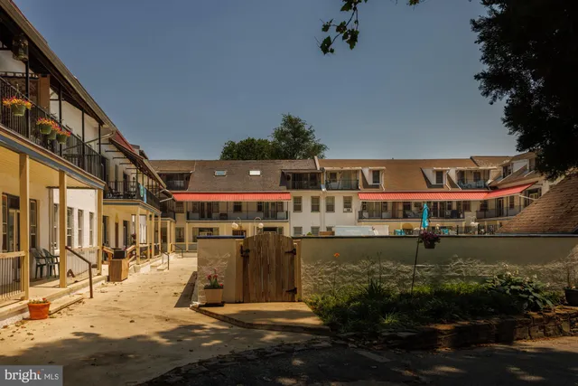 a view of a porch with floor to ceiling window with wooden floor