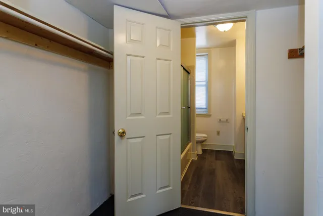 a bathroom with a glass shower door