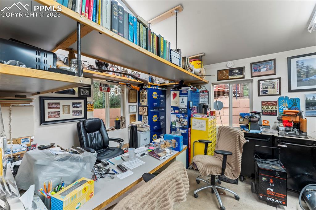 8025 Topeka Avenue Cascade, CO 80809 - Photo 13 of 42 a living room with furniture fireplace and a flat screen tv