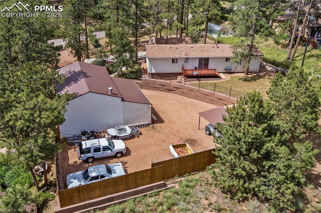 8025 Topeka Avenue Cascade, CO 80809 - Photo 2 of 42 an aerial view of a house with garden space and street view