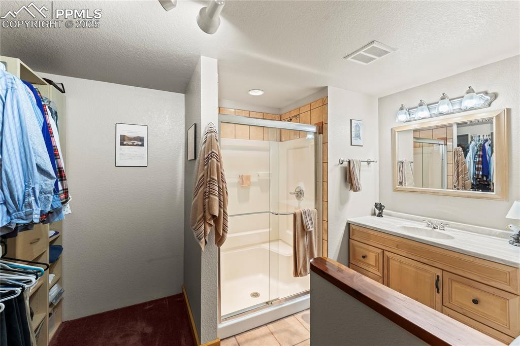 8025 Topeka Avenue Cascade, CO 80809 - Photo 36 of 42 a bathroom with a bathtub and a sink