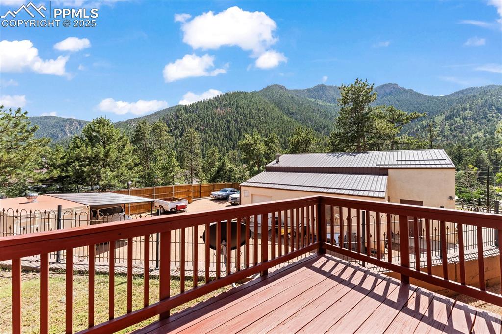 8025 Topeka Avenue Cascade, CO 80809 - Photo 37 of 42 a view of balcony with wooden floor and fence