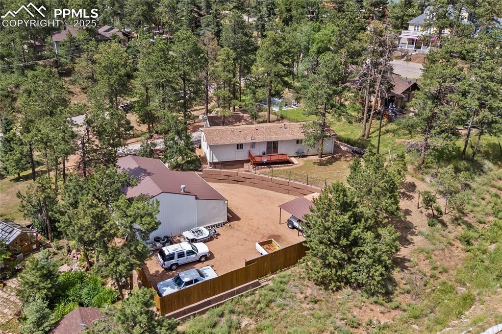 8025 Topeka Avenue Cascade, CO 80809 - Photo 40 of 42 an aerial view of a house with yard swimming pool and outdoor seating
