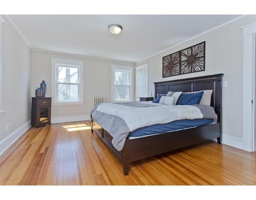 48 Sylvan Street Springfield, MA 01108 - Photo 18 of 28 a spacious bedroom with a bed and wooden floor