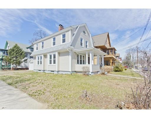 48 Sylvan Street Springfield, MA 01108 - Photo 2 of 28 a view of a big house with a big yard and large tree