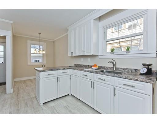 48 Sylvan Street Springfield, MA 01108 - Photo 8 of 28 a kitchen with granite countertop white cabinets and sink