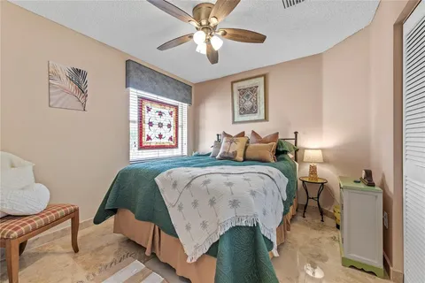 a bedroom with bed and a window