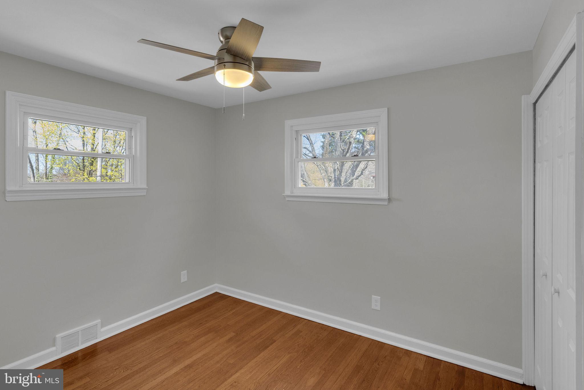 77 Davis Road Doylestown, PA 18901 - Photo 17 of 31 a view of empty room with wooden floor and fan