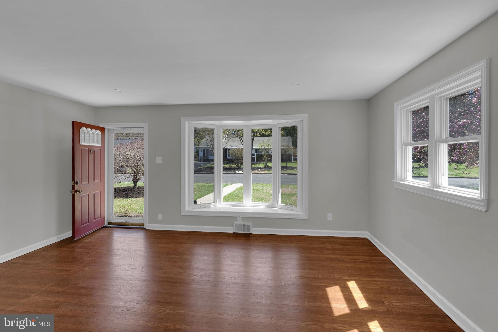 77 Davis Road Doylestown, PA 18901 - Photo 2 of 31 a view of empty room with wooden floor and fan