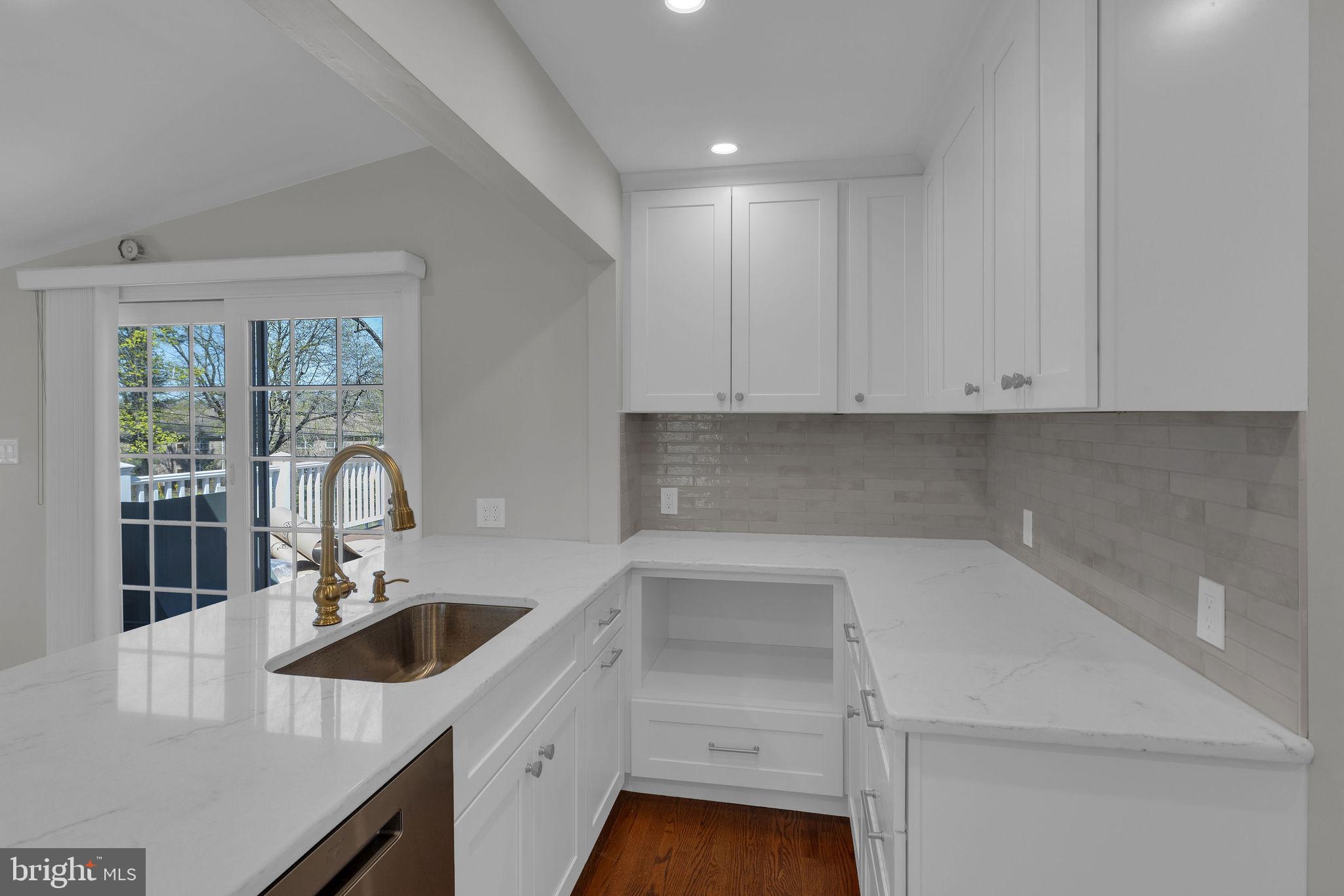 77 Davis Road Doylestown, PA 18901 - Photo 4 of 31 a kitchen with a sink cabinets and window