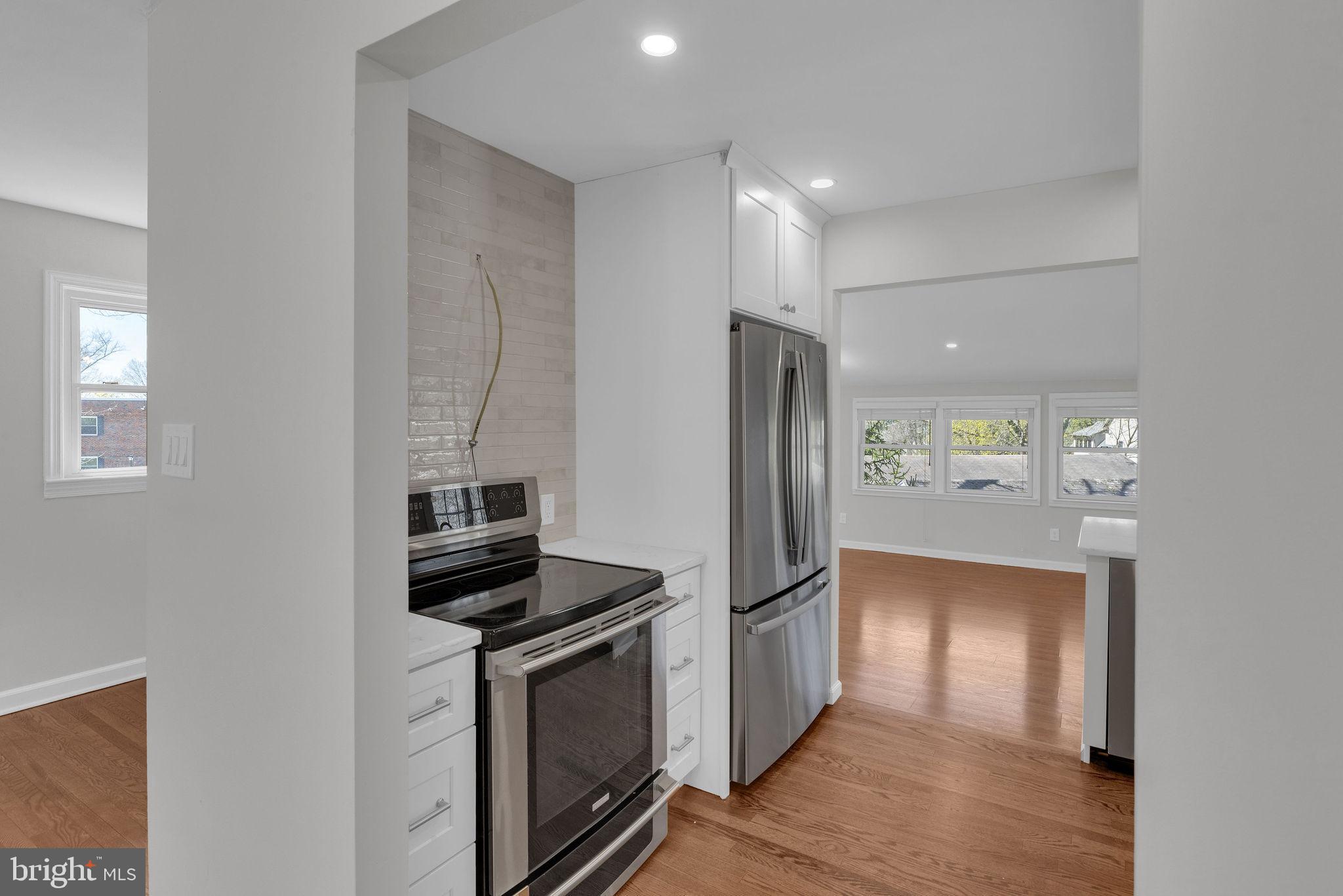 77 Davis Road Doylestown, PA 18901 - Photo 7 of 31 a kitchen with stainless steel appliances a refrigerator and a stove top oven