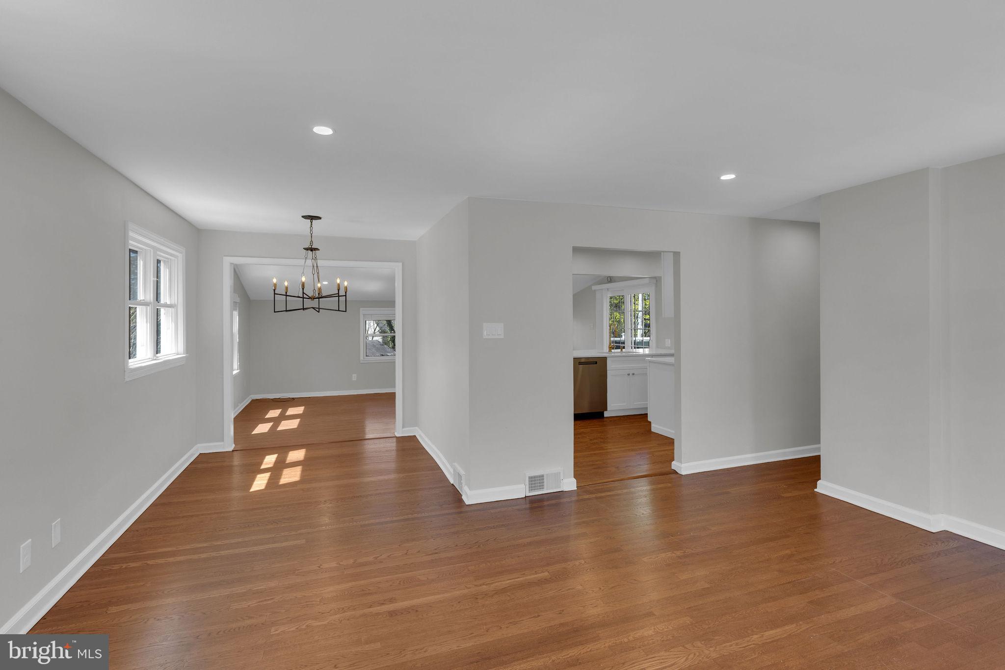 77 Davis Road Doylestown, PA 18901 - Photo 9 of 31 a view of an empty room with wooden floor and windows
