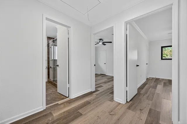 wooden floor with white walls