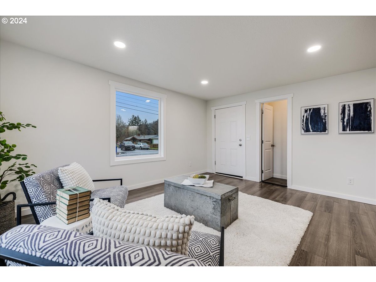 711 Southeast 5th Street Gresham, OR 97080 - Photo 12 of 44 a bedroom with furniture and a wooden floor