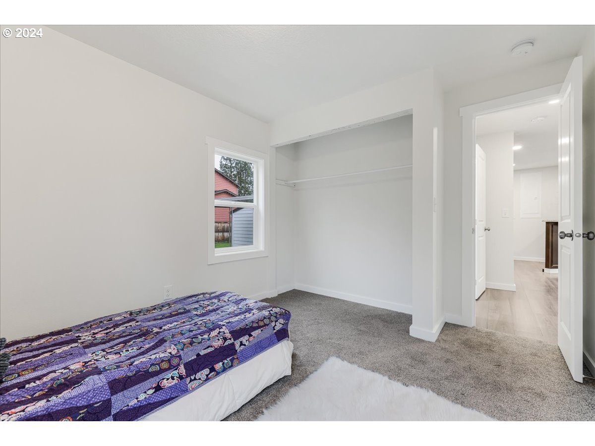 711 Southeast 5th Street Gresham, OR 97080 - Photo 25 of 44 a bedroom with a bed and a view of bathroom