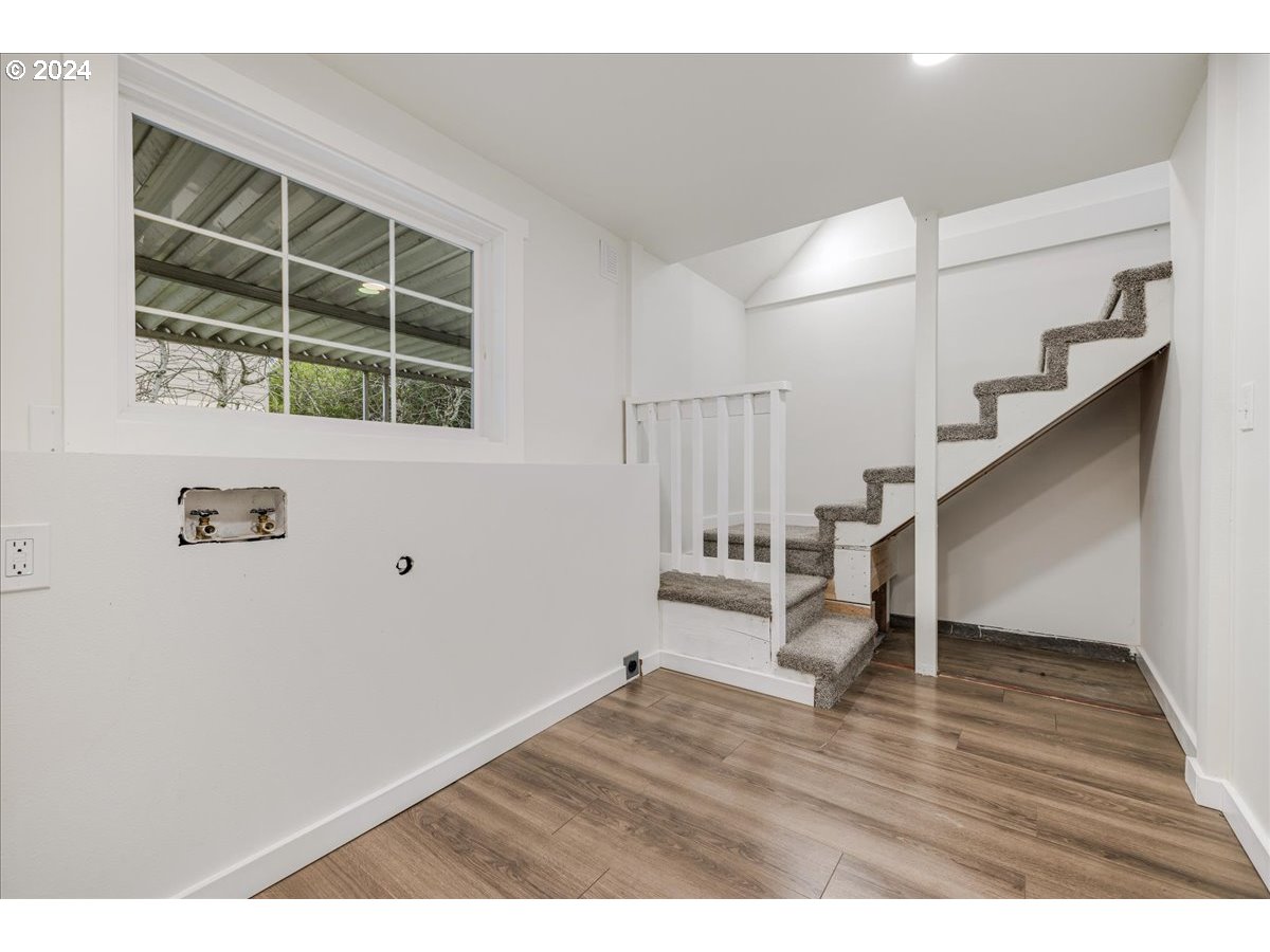 711 Southeast 5th Street Gresham, OR 97080 - Photo 29 of 44 a view of entryway and hall with wooden floor
