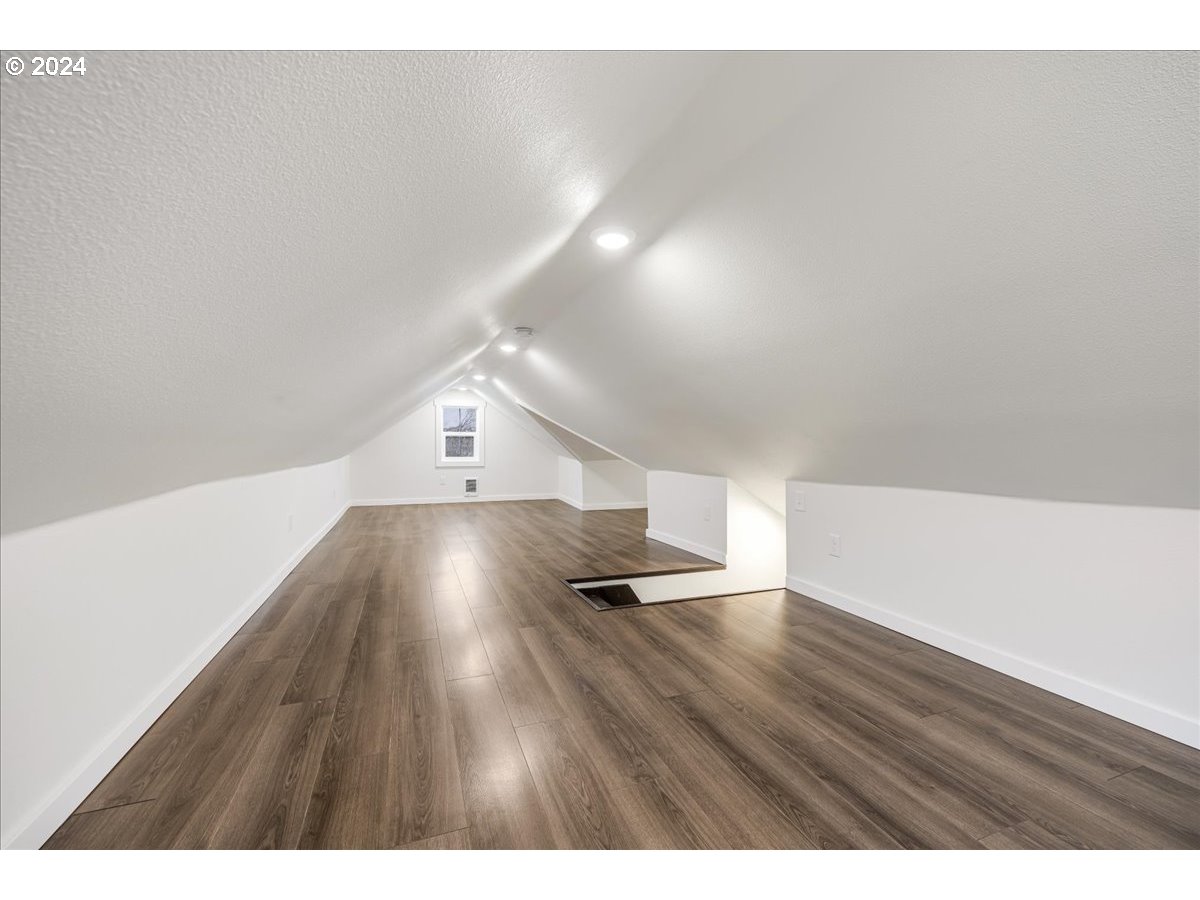 711 Southeast 5th Street Gresham, OR 97080 - Photo 33 of 44 a view of an empty room with wooden floor