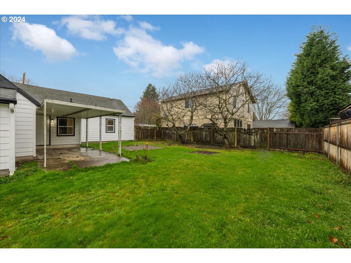 711 Southeast 5th Street Gresham, OR 97080 - Photo 39 of 44 a view of a backyard with plants and a garden
