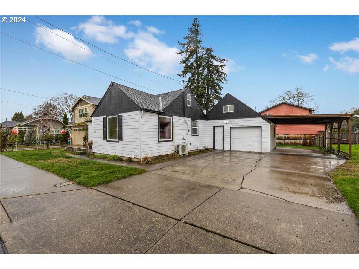 711 Southeast 5th Street Gresham, OR 97080 - Photo 5 of 44 a view of a house with a yard and potted plants