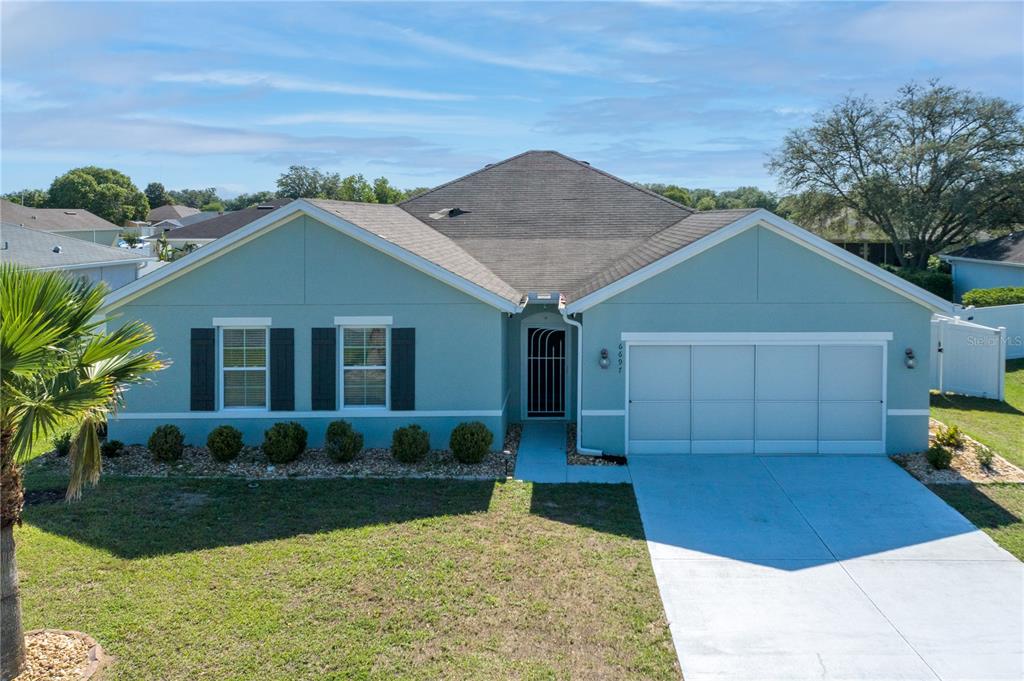 Don’t wait for new construction! This lightly lived in home is filled with builder UPGRADES without the builder price tag and has a huge FLORIDA ROOM that runs the length of the home for additional flexible living space!