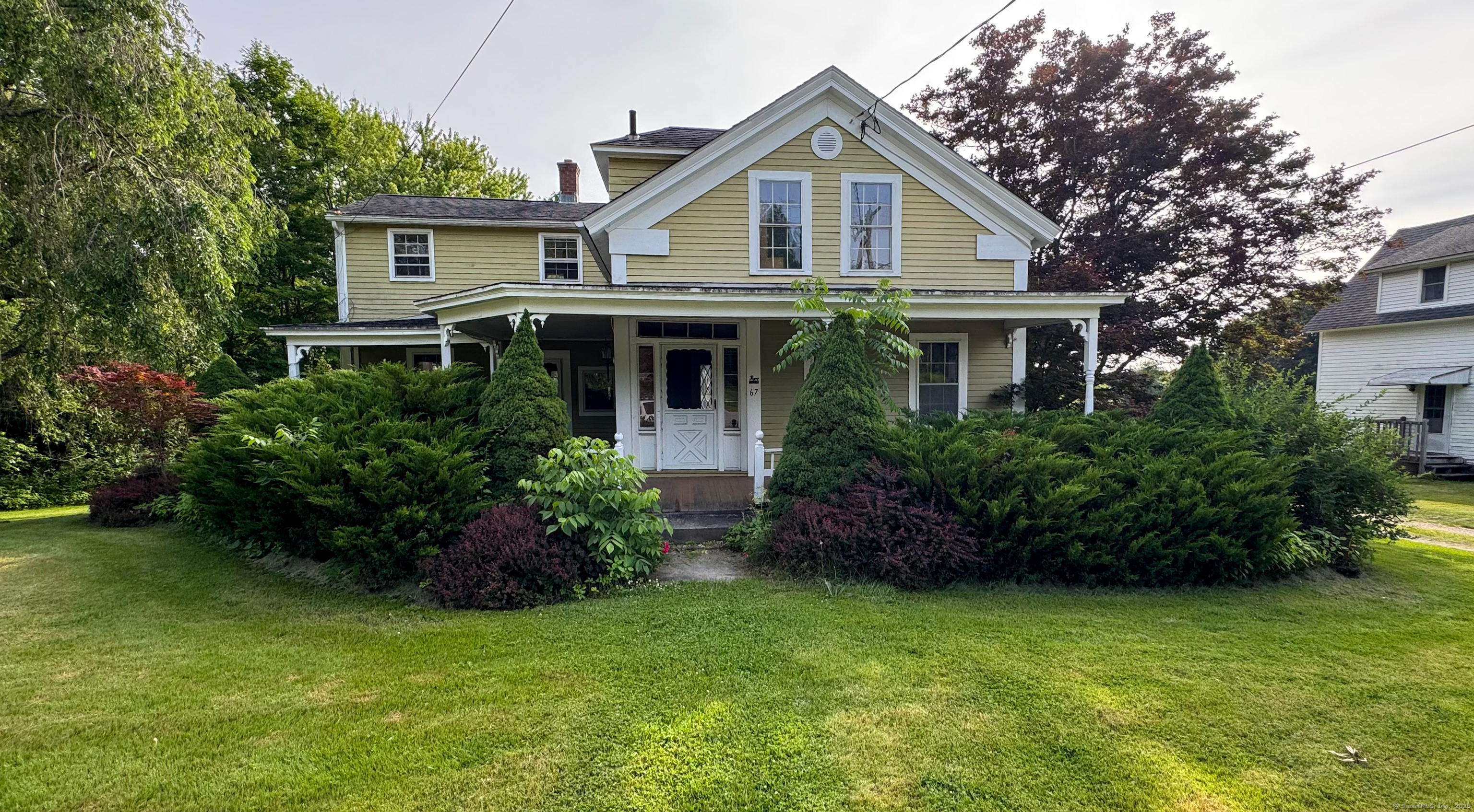 67 North Road Windham, CT 06280 - Photo 1 of 1 a front view of a house with a garden