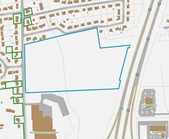 a white cabinet sitting next to a window