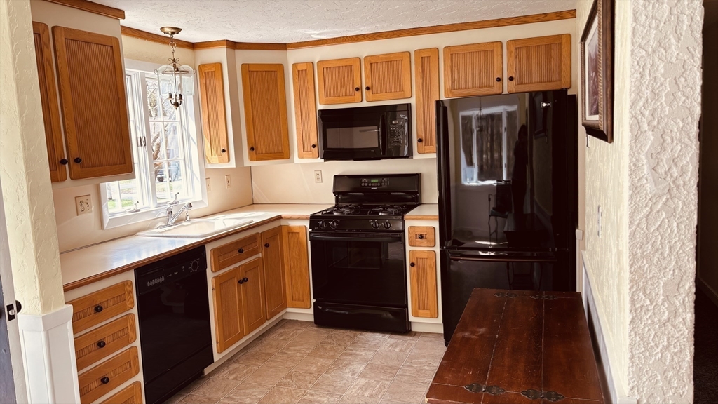 29 Forest Street Franklin, MA 02038 - Photo 2 of 19 a kitchen with stainless steel appliances granite countertop a refrigerator and a sink
