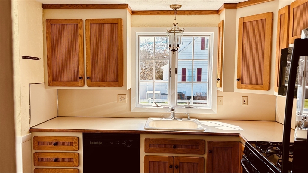 29 Forest Street Franklin, MA 02038 - Photo 3 of 19 a kitchen with a sink and a window