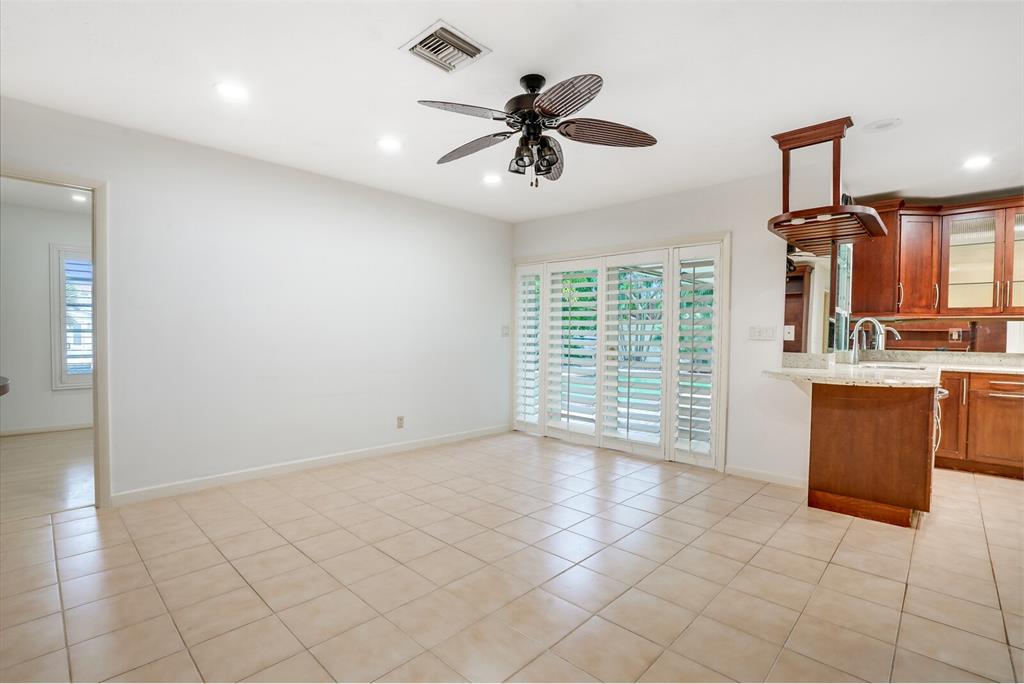 3721 Northeast 29th Avenue Lighthouse Point, FL 33064 - Photo 22 of 43 a view of a livingroom with a ceiling fan and window