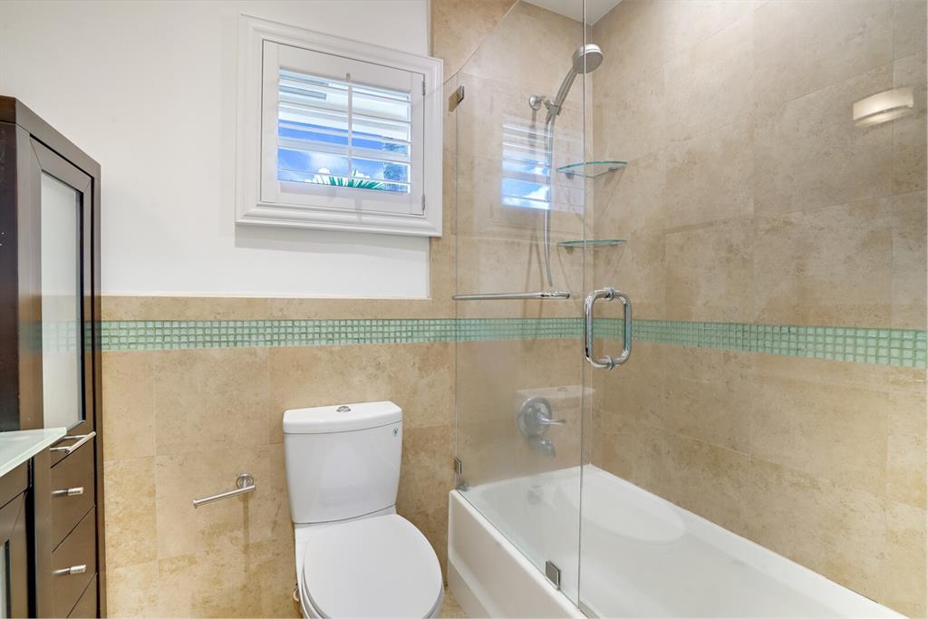 3721 Northeast 29th Avenue Lighthouse Point, FL 33064 - Photo 27 of 43 a bathroom with a toilet a sink and bathtub