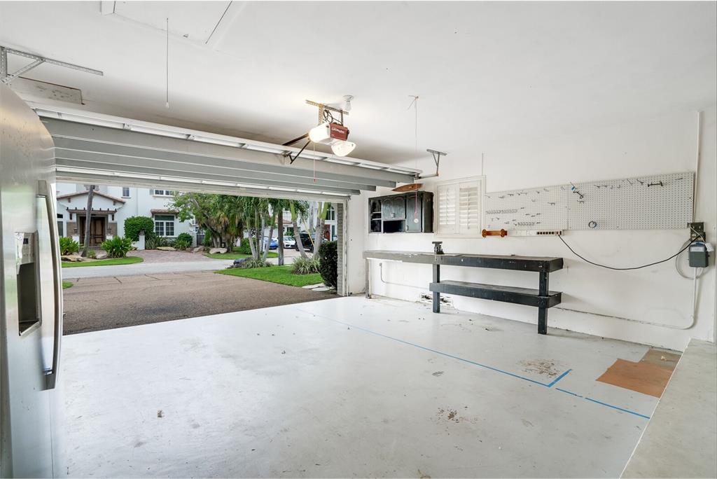 3721 Northeast 29th Avenue Lighthouse Point, FL 33064 - Photo 33 of 43 a living room with patio furniture and a fireplace