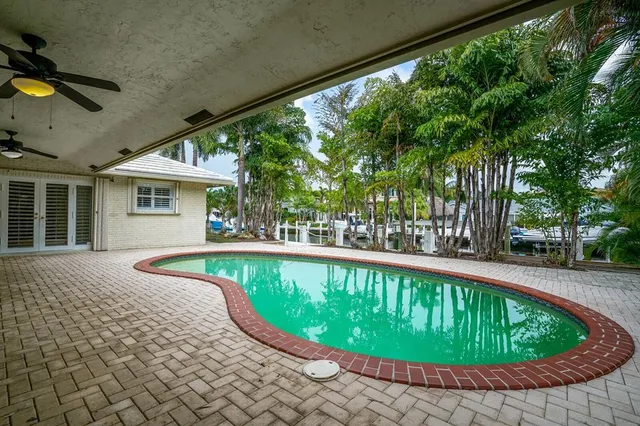 a view of a swimming pool with a patio