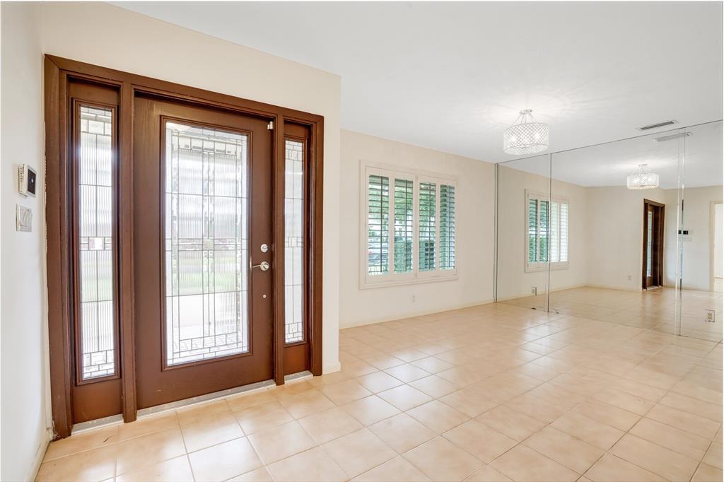 3721 Northeast 29th Avenue Lighthouse Point, FL 33064 - Photo 5 of 43 a view of an empty room with a window