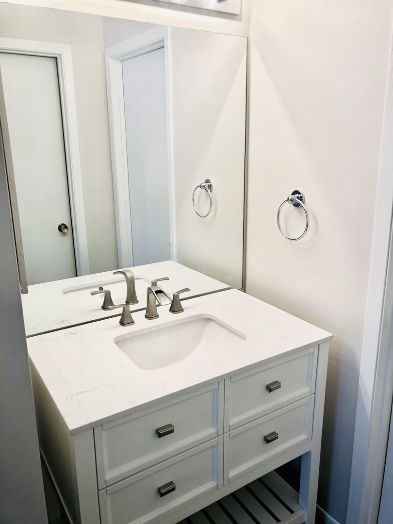 2017 Windemere Circle, Unit 2017 Schaumburg, IL 60169 - Photo 12 of 15 a bathroom with a sink vanity and a mirror