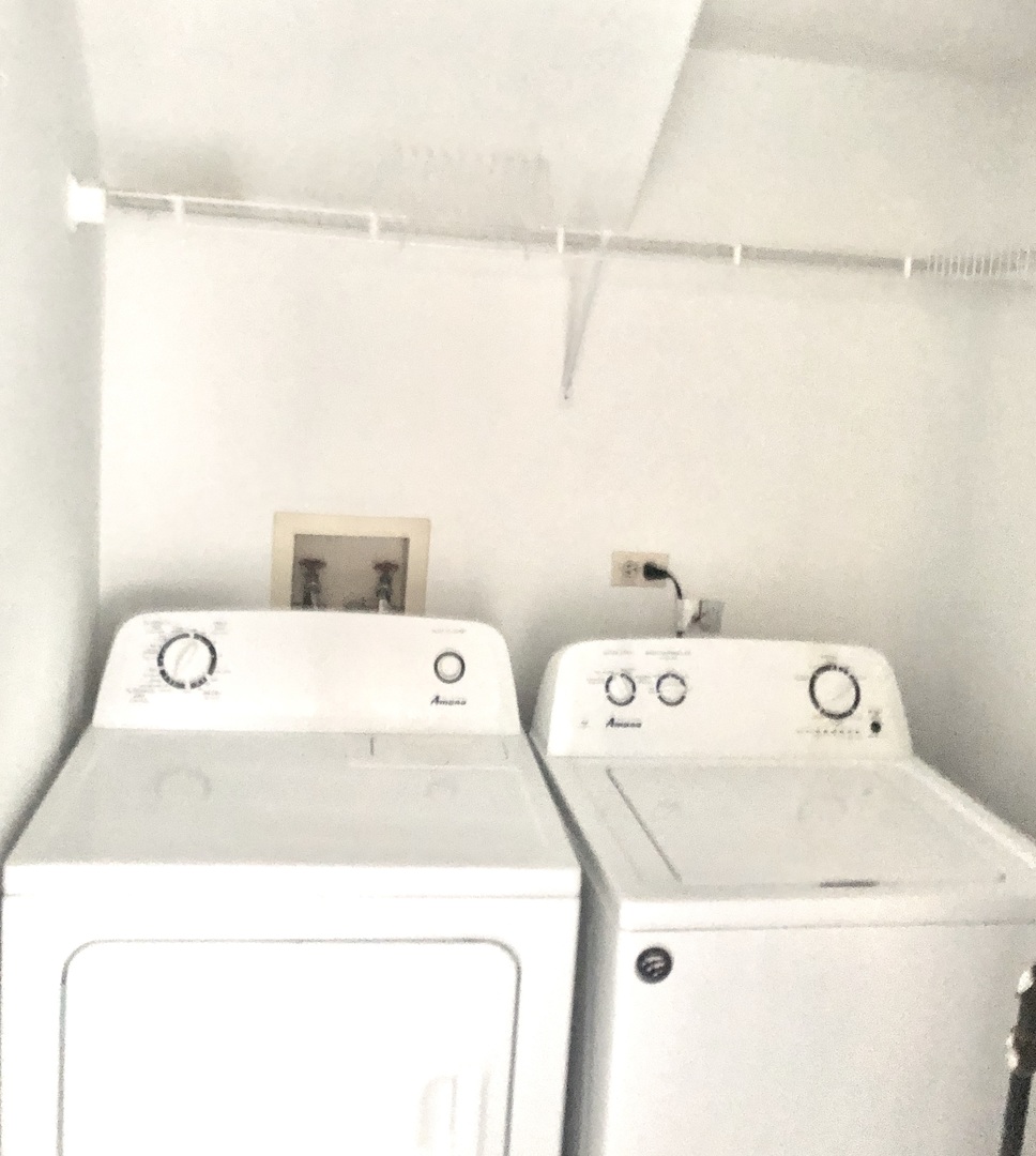 2017 Windemere Circle, Unit 2017 Schaumburg, IL 60169 - Photo 14 of 15 a utility room with dryer and washer