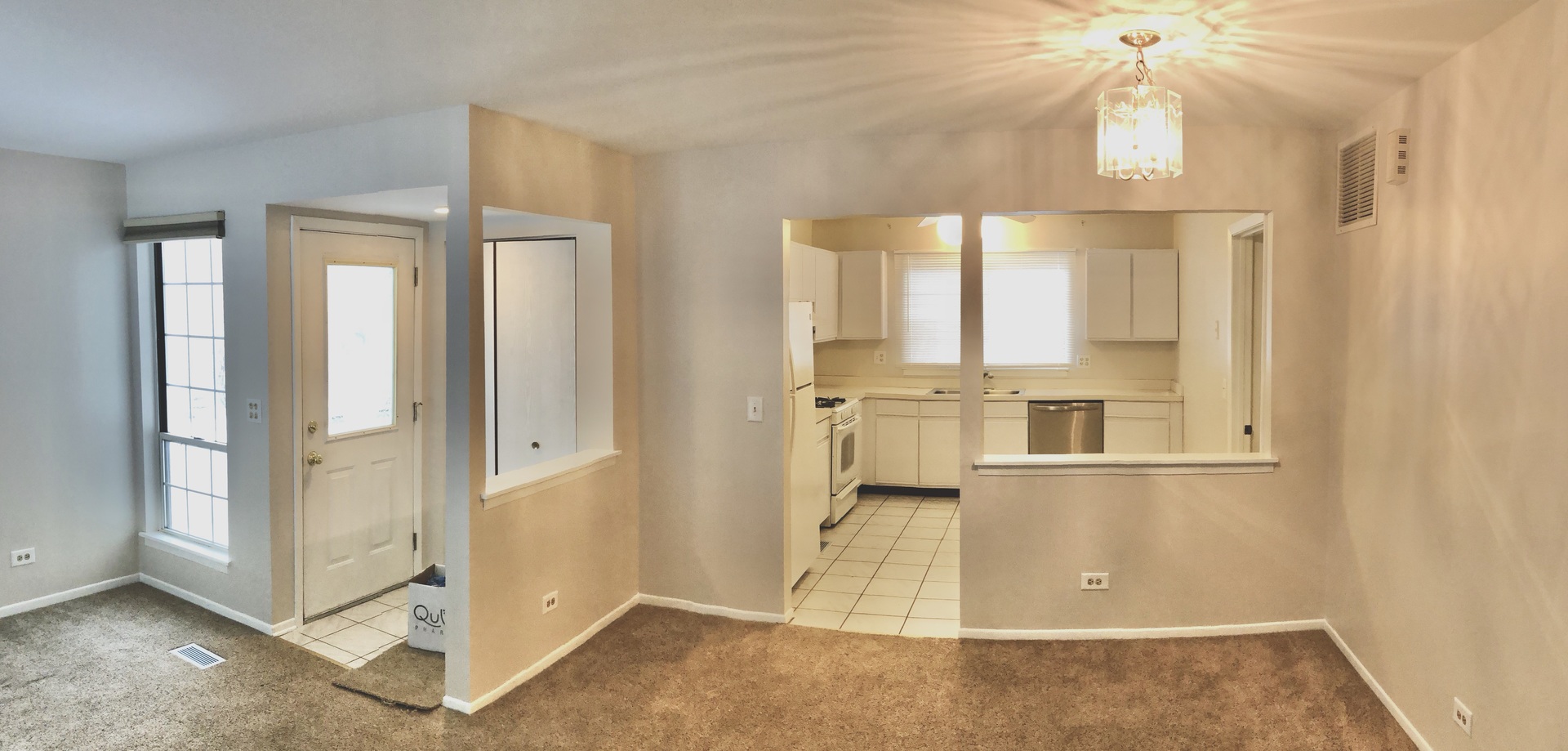 2017 Windemere Circle, Unit 2017 Schaumburg, IL 60169 - Photo 3 of 15 an entryway of a house with wooden floor windows and chandelier fan