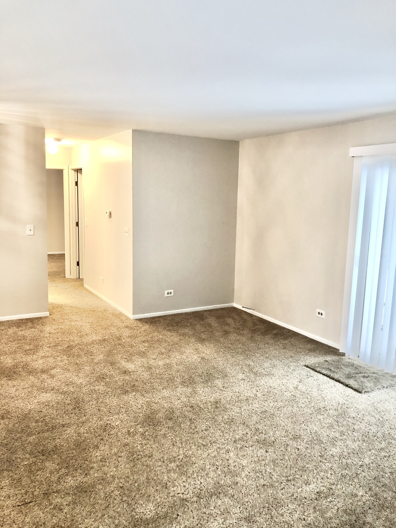 2017 Windemere Circle, Unit 2017 Schaumburg, IL 60169 - Photo 9 of 15 a view of an empty room