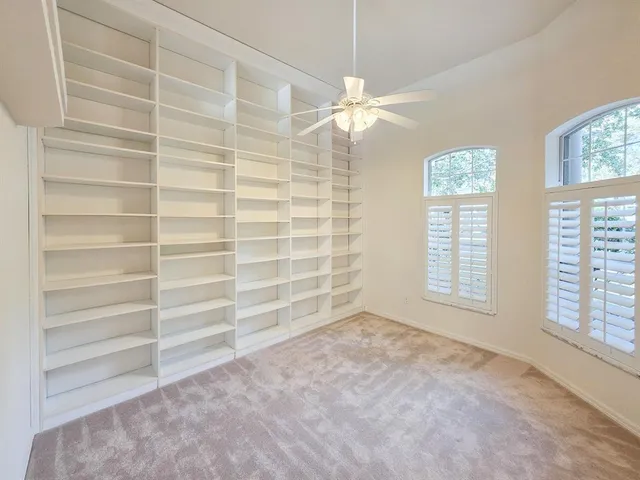 an empty room with fan