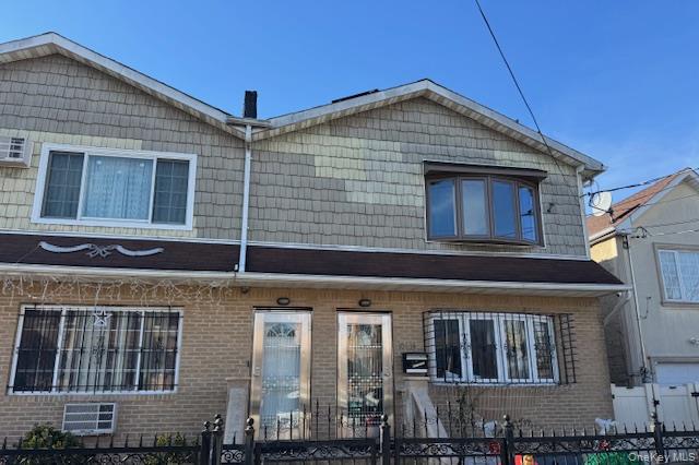 103-14 169th Street Queens, NY 11433 - Photo 1 of 18 a front view of a house