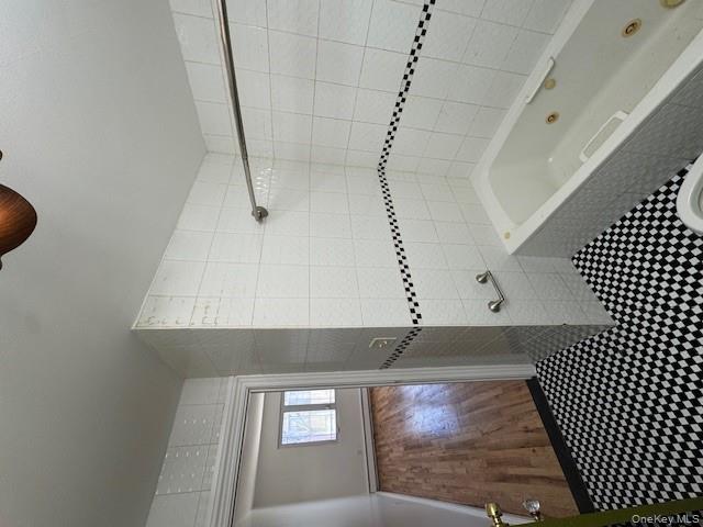 103-14 169th Street Queens, NY 11433 - Photo 18 of 18 a bathroom with a bathtub and a shower
