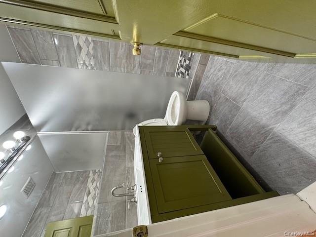 103-14 169th Street Queens, NY 11433 - Photo 10 of 18 a bathroom with a sink and a mirror