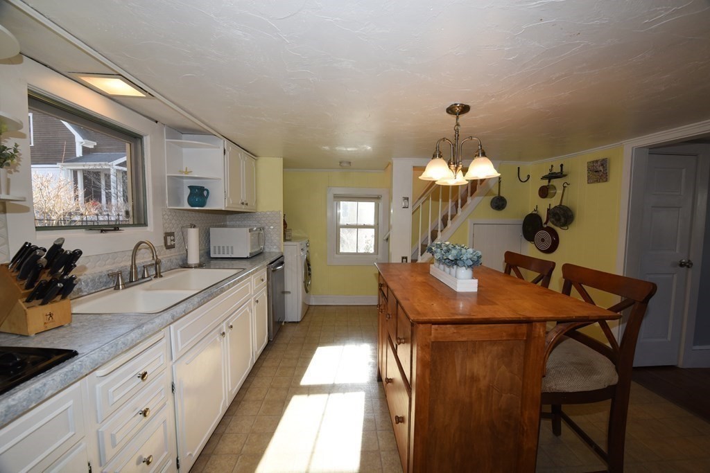 7 Summer Street Kingston, MA 02364 - Photo 14 of 41 a kitchen with stainless steel appliances granite countertop sink stove top oven and cabinets