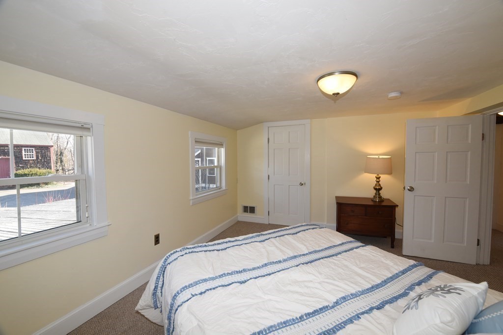 7 Summer Street Kingston, MA 02364 - Photo 23 of 41 a bedroom with a bed and a window