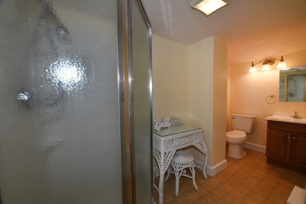 7 Summer Street Kingston, MA 02364 - Photo 25 of 41 a bathroom with a toilet a sink and mirror