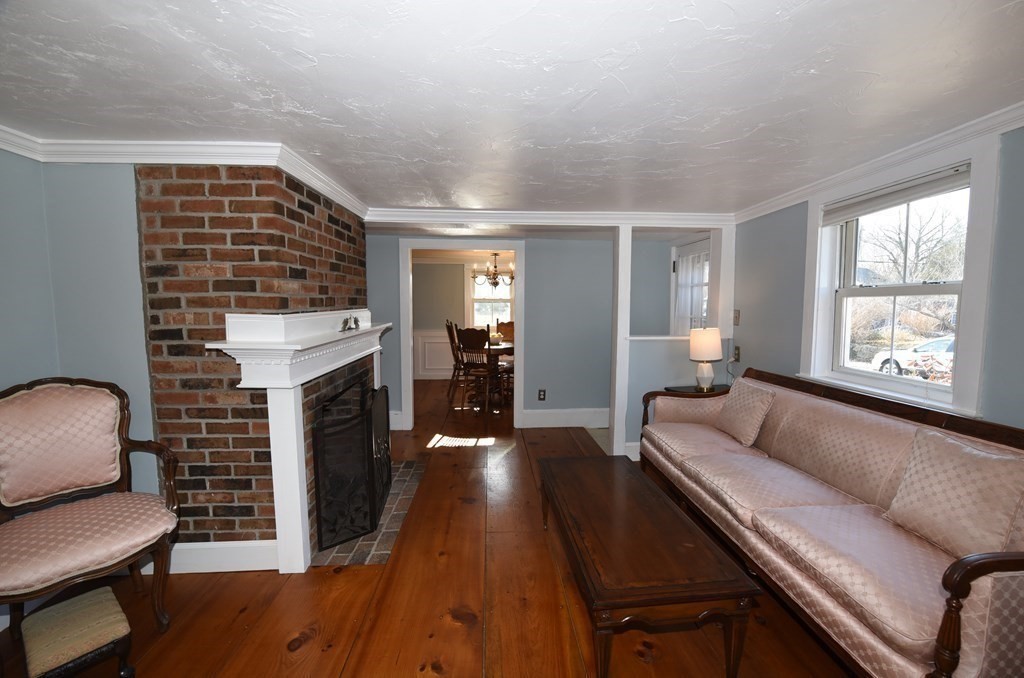 7 Summer Street Kingston, MA 02364 - Photo 4 of 41 a living room with furniture and a fireplace