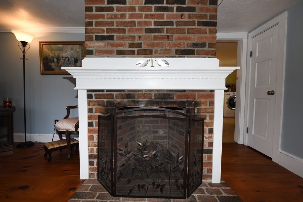7 Summer Street Kingston, MA 02364 - Photo 5 of 41 a close view of a fireplace in wooden floor
